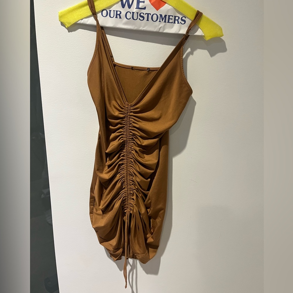 fitted brown strappy minidress with front ruching that ties at the bottom